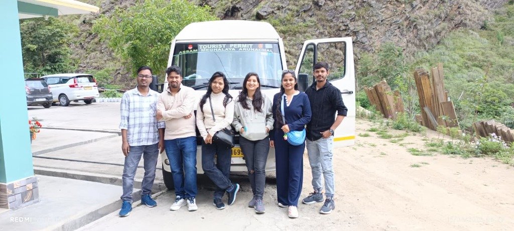 Happy Travellers with Tour Vehicle