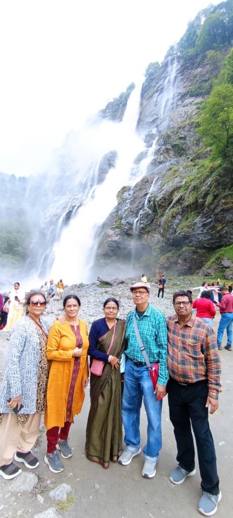 Tour group at majestic waterfalls in Northeast
